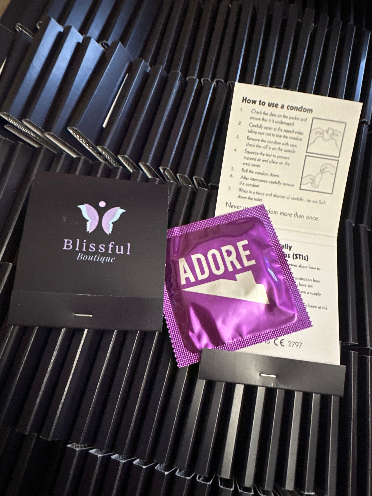 Individual Blissful Boutique branded Condoms. (ADORE brand ribbed condoms)